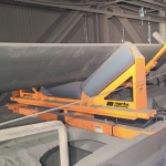 Responsive conveyor belt tracker improves production and safety 